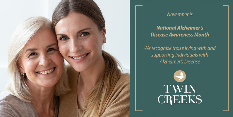 Caregiver and mom with Alzheimer's smiling at camera to raise awareness of the disease